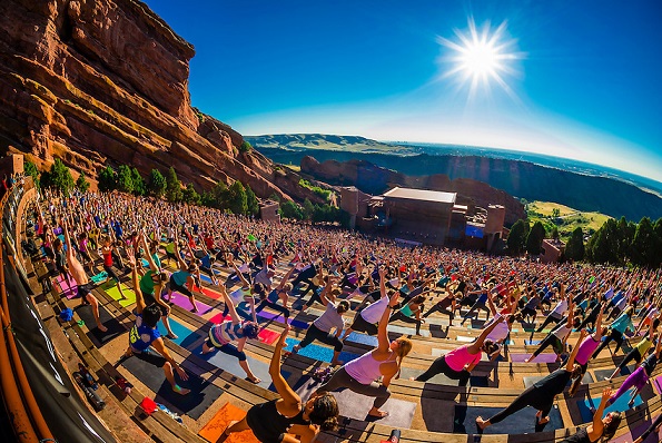 "Yoga on the Rocks"; 2000 people doing yoga together at Red Rocks Amphitheatre, Morrison (Denver), Colorado USA.